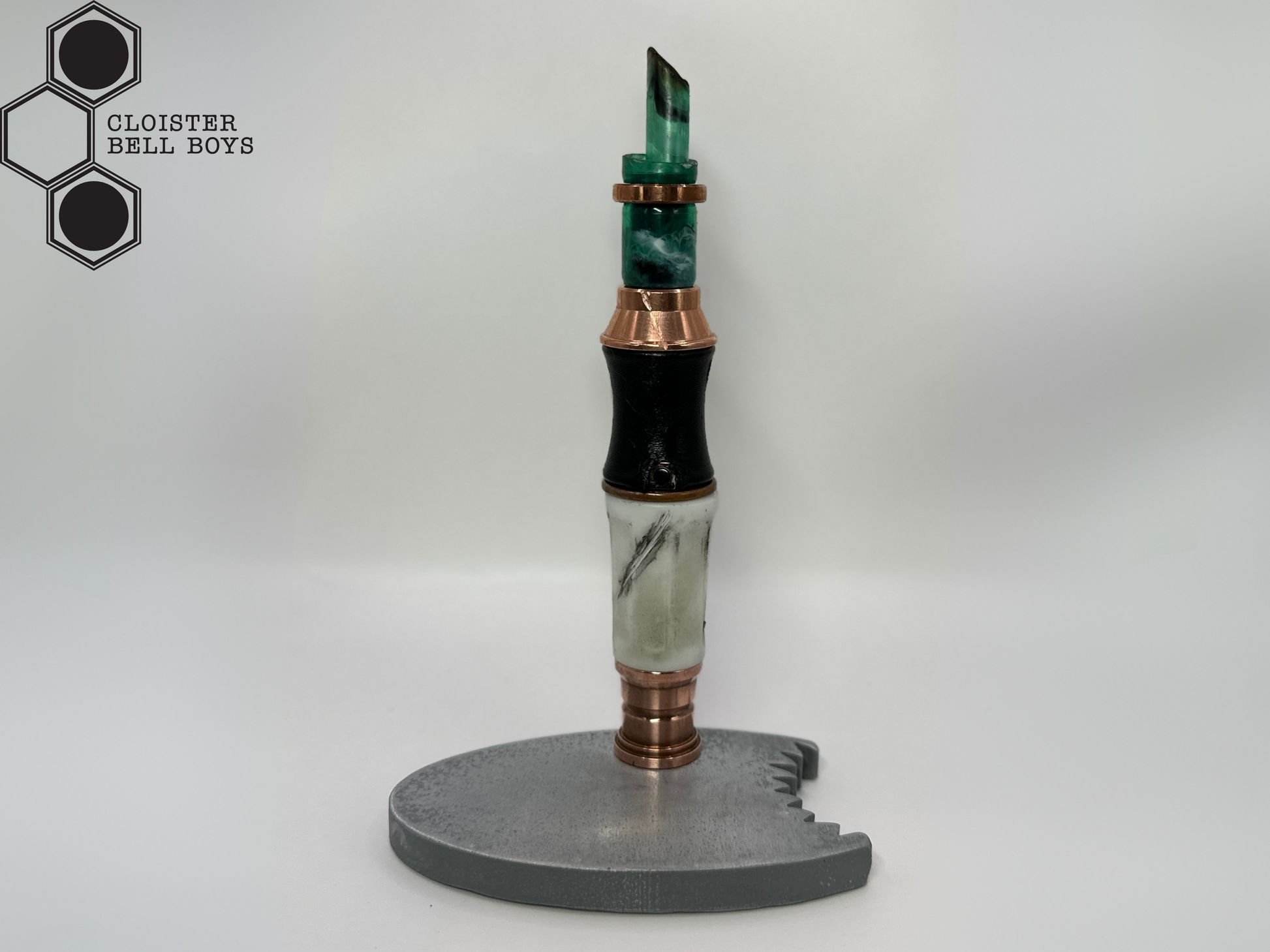 Shark-Bitten Screwdriver in a metallic gray stand against a white background, branded 'Cloister Bell Boys'.