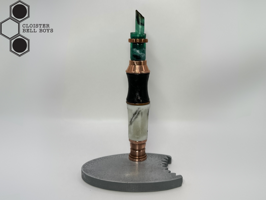 Shark-Bitten Screwdriver in a metallic gray stand against a white background, branded 'Cloister Bell Boys'.